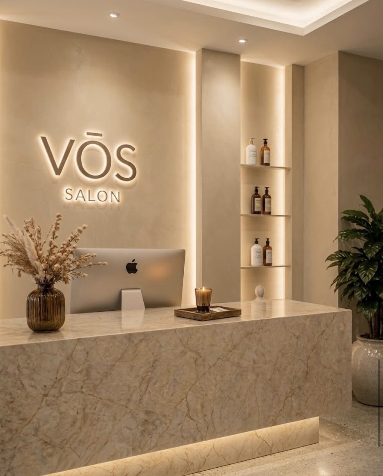 VŌS luxury reception with marble counter and warm lighting